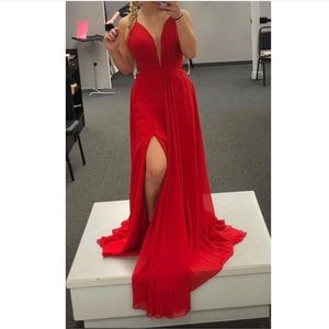 Red prom dress with a lace up back and slit